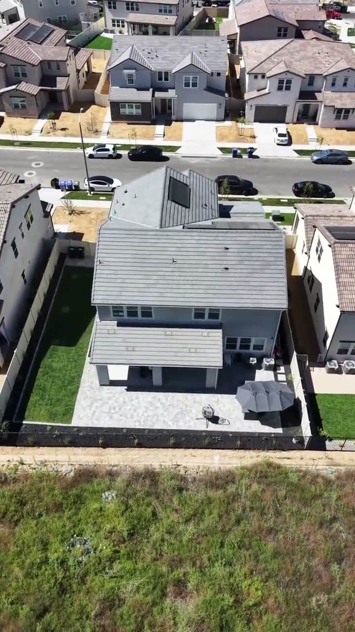 Aerial view of a completed hillside backyard by Five Stars Builders