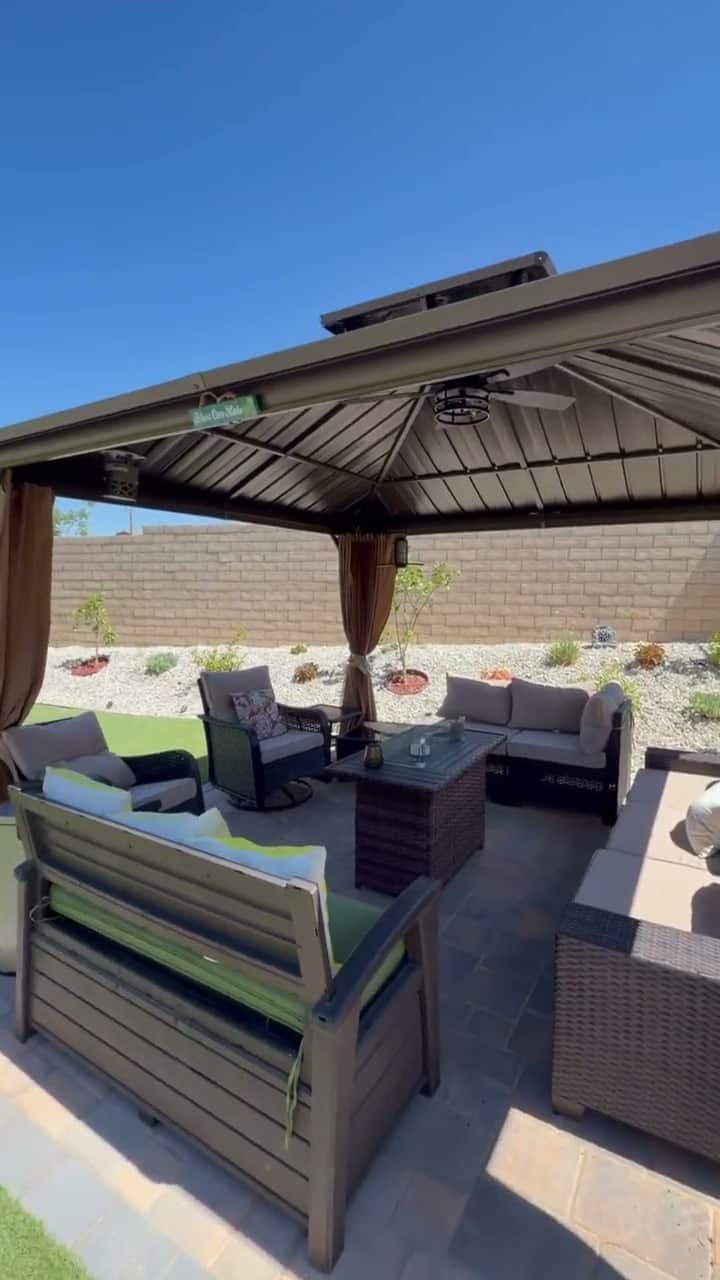 Covered patio gazebo with ceiling fan and outdoor seating completed by Five Stars Builders in a Southern California backyard