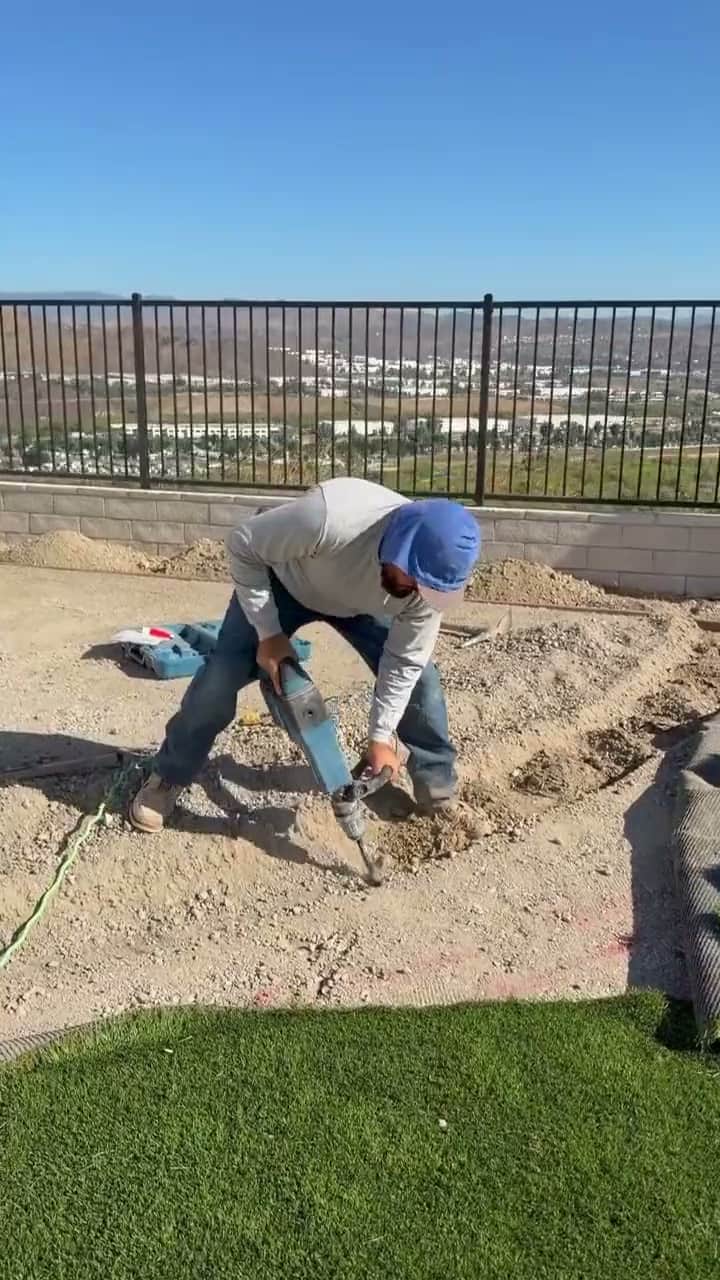Five Stars Builders crew trenching groundworks for irrigation lines in a Southern California backyard